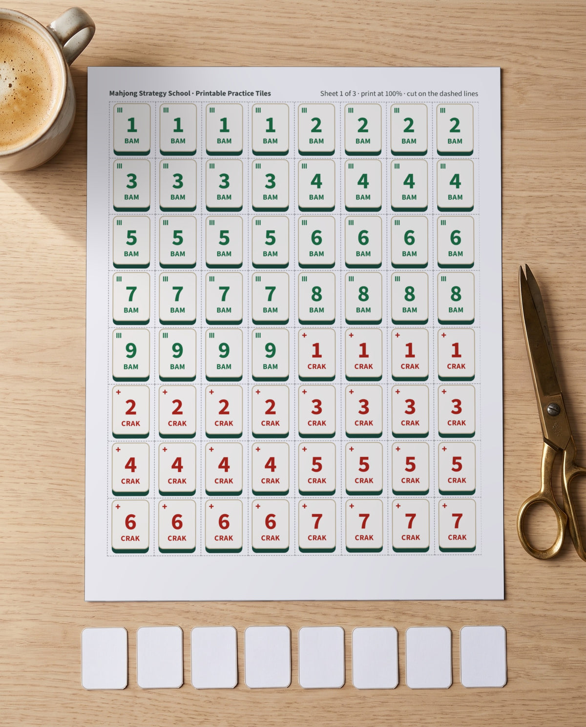 A printed sheet of practice tiles with scissors